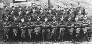 Above Launceston Homeguard in 1945. Back row, extreme right, W.S. Cottle. Middle row, 5th from left, W.H.(Bill) Jones, agricultural engineer and blacksmith. Front row, 5th from right, W.T.(Bill) Gynn, postman and part-time farmer. Photo courtesy of Chris Gynn.
