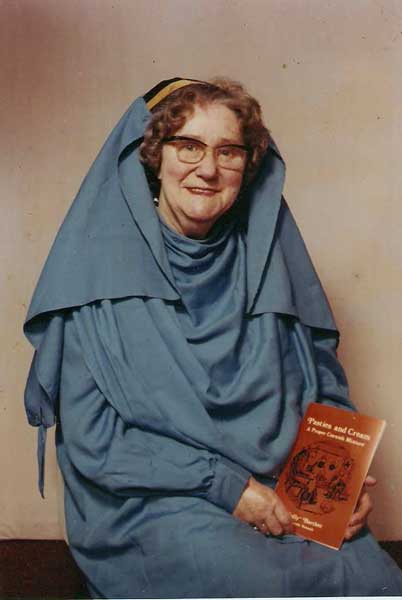 millicent-bartlett-in-her-robe-holding-one-of-her-books-pasties-and-cream