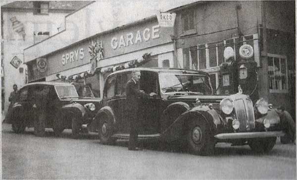 Above Percy Spry greets the Queen and Prince Charles on their 1953 visit when they stopped at the Exeter Street Garage.