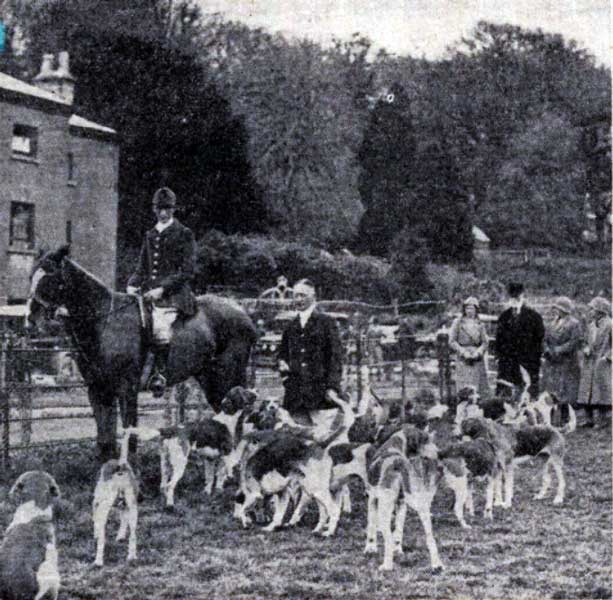 Major E. Rodd with the Huntsman of the East Cornwall Hunt in 1933 at his residence of Trebartha Hall which part of can be seen. 
