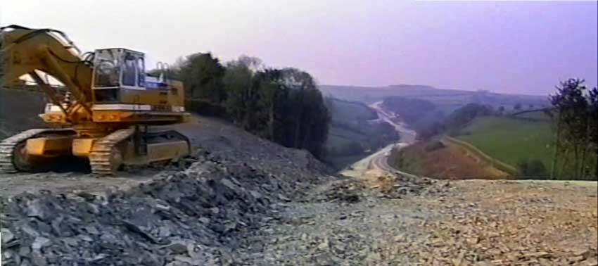 Above looking down towards Two Bridges in 1989 with the new A30 being cut through part of Strayer Park, Trevell.