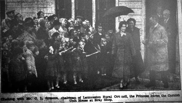 Princess Elizabeth chats with Charles Symons at Bray Shop in 1949.