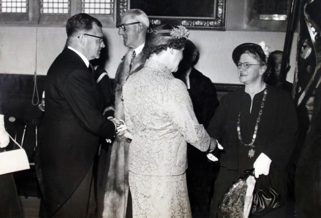 Cecil Robins congratulates the new mayor 1956