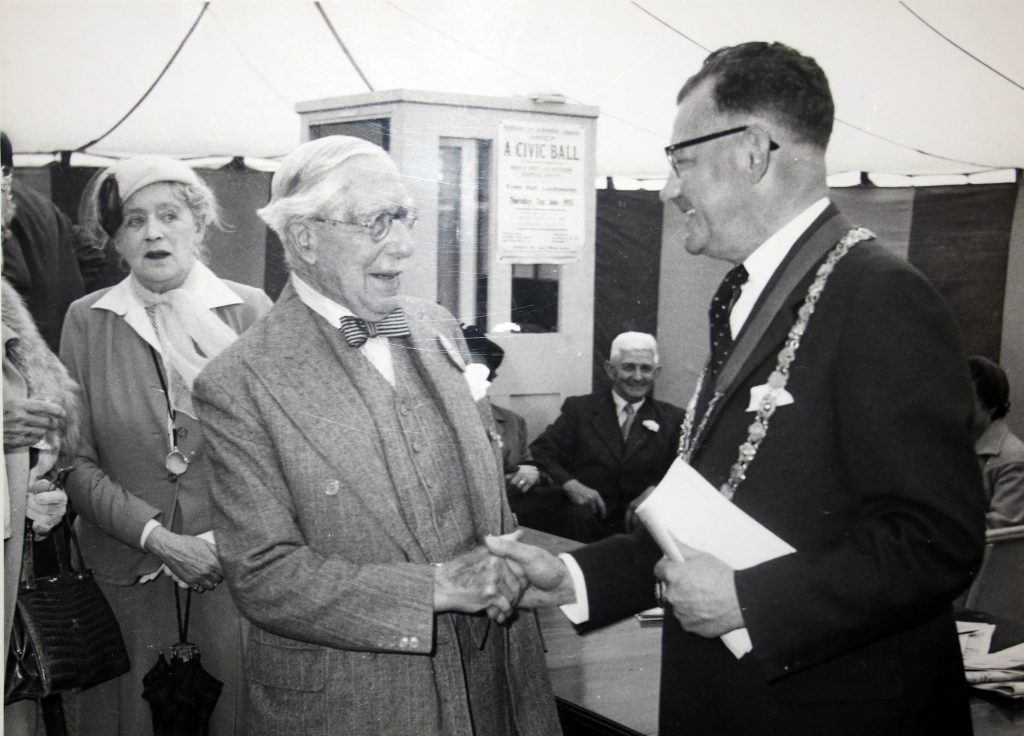 Cecil Robins greets a delegate at the 1955 Bath and West Show