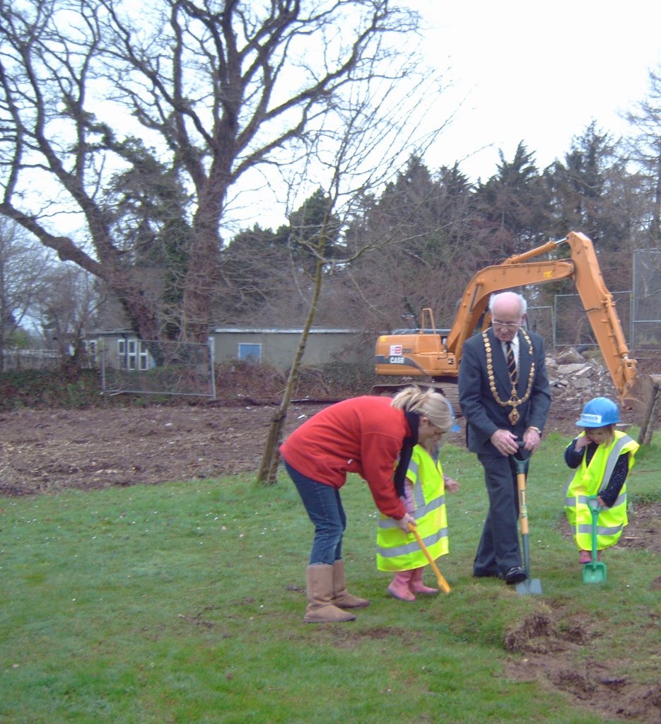 Mayor Eric Chapman cuts the first sod on the new childrens centre at Coronation Park