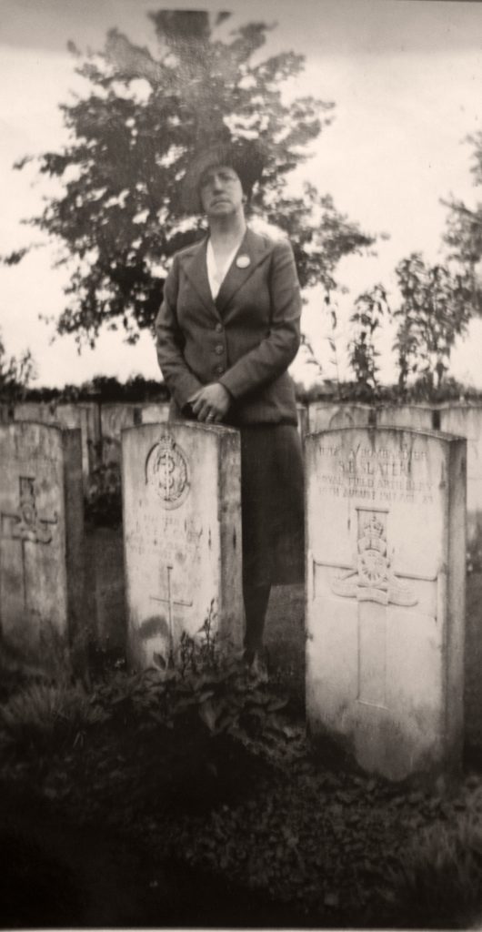 Gertrude Cavey photographed by her husbands grave.
