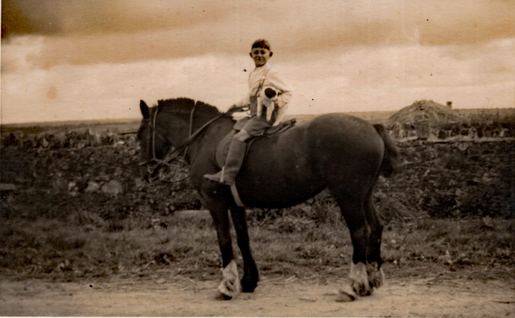 A young Eldred Broad on a farm horse