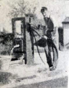 A young man using the pump at South Petherwin.
