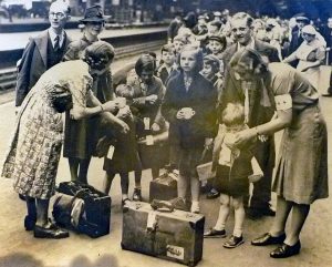 Evacuees gather at a railway station.
