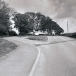 The A388 (Tavistock Road) at the Eastfield Farm and Braeside entrance. This is now the position of the roundabout that leads onto the Stourscombe Estate and the A30. McAlpine's had their site office on the farm during the by-pass construction. Photo courtesy of Steve Dymond.