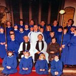 St. Thomas Church, Launceston, Late 70’s-Early ‘80’s - New choir robes. Back row: Ian Parnell, Jim Wheaton, Graham Parnell, Jimmy Gynn, Rob Mounce, Aubrey Gregory, Bill Roberts.
Row 2: Catherine Striplin (Parnell), Sharon Parnell (Tout), Judy Goodman, Sandra Slee (partly hidden), Linda Ellacott, Helen Porter (Ellacott), Miss Carlisle.
Row 3: Kate Matthews, Nicky Clements, Sarah Slee, Ruth Pitt (Worsnip), choir master Brian Steer, James Worsnip, Philip Stilgoe?, Kevin Chapman, Wendy Searle (Downing).
Row 4: Arthur Wills, Rev. Hughes?, Rev. Michael Fisher, Pam Parnell.
Front row: Emma Matthews, Juliet Couch (Sharpe), Amber Sharpe, Lisa Dymond (Parnell).
Photo courtesy of Sharon Parnell St. Thomas Church, Launceston, Late 70’s-Early ‘80’s - New choir robes. Photo courtesy of Sharon Parnell