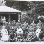 Convalescing soldiers with their V.A.D. nurses outside the Castle Lodge,