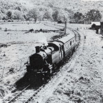 Train passes by the Leat Corn Mill.