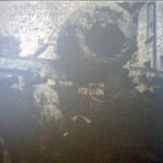 Wide load stuck bewteen houses at Lifton in 1949.