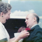 Derek gets his buttonhole straightened by Mrs. Buckeridge.