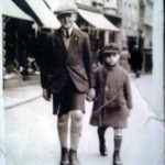 Ronald and Ken Hillman walking up High Street in the 1920's.