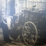 'Dixie' Parker repairing an Umbrella outside St. Marys Church, Launceston in 1900.